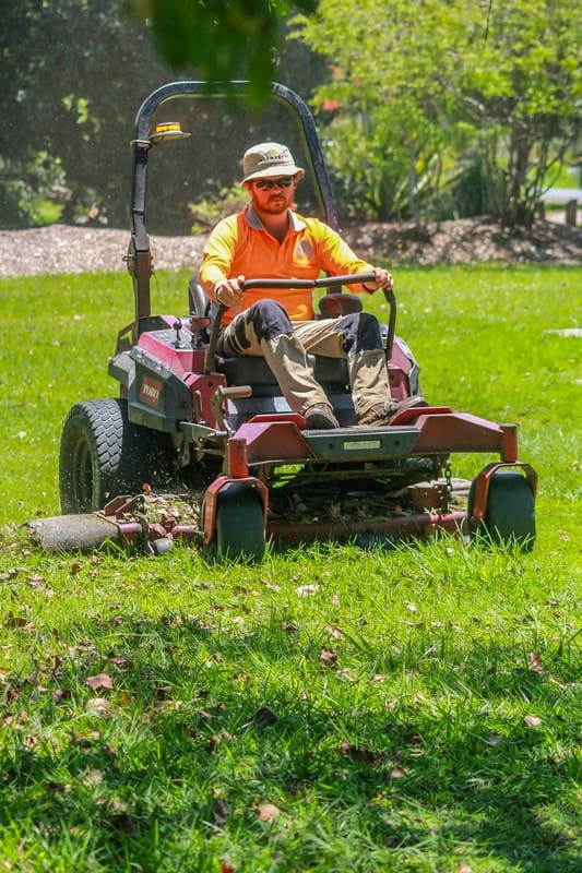 Element Queensland crew on ride-on mower in action