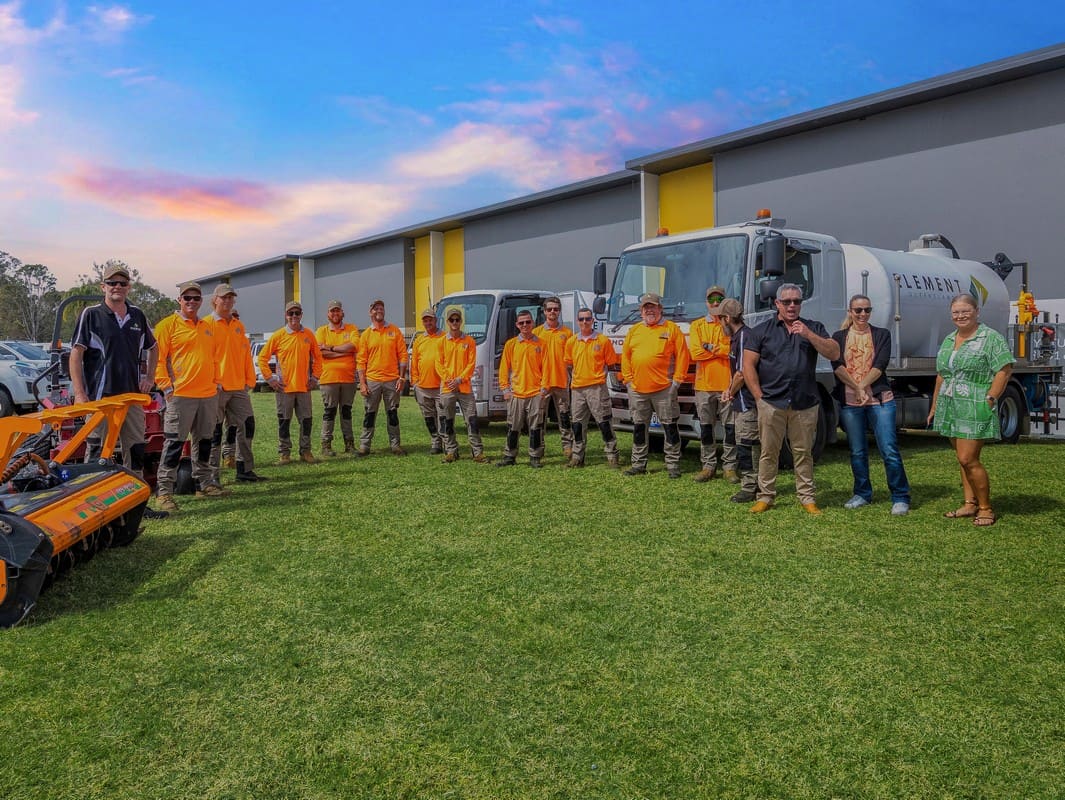 Element Queensland team gathered outdoors at sunset