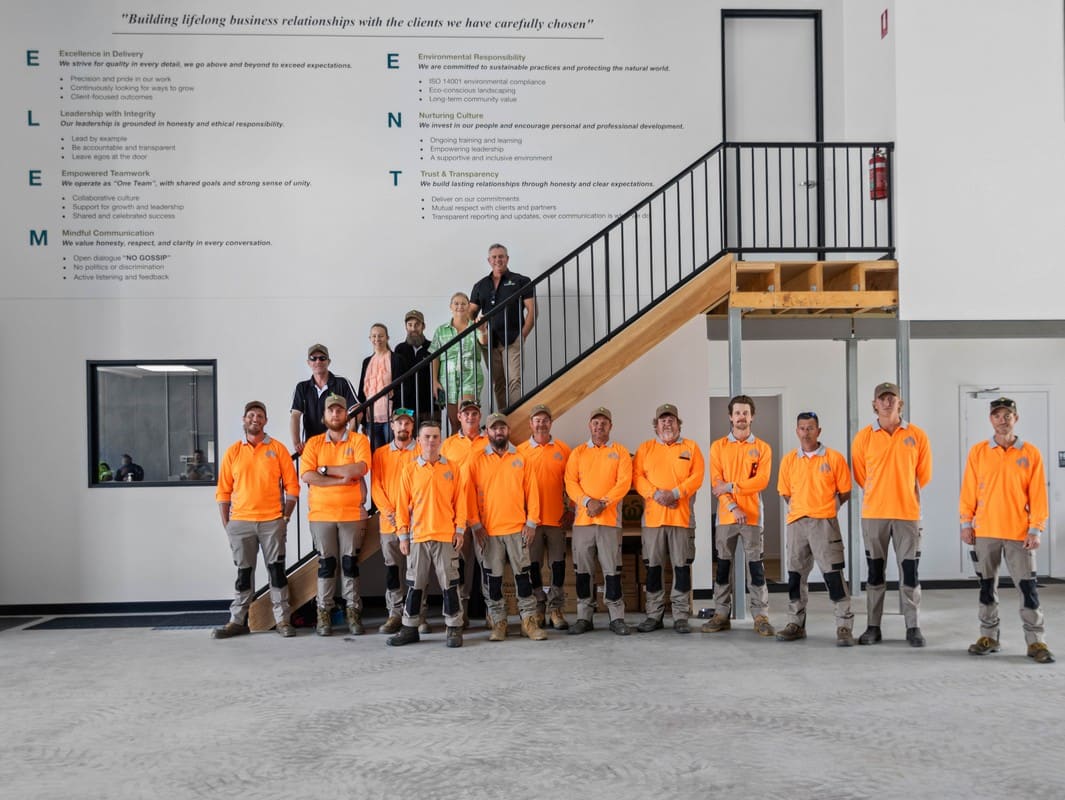 Element Queensland team group photo on stairs displaying core values