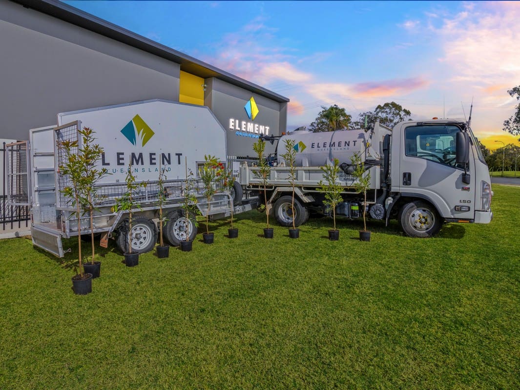 Element Queensland tipper truck loaded with tree limbs at sunset after storm-prep works