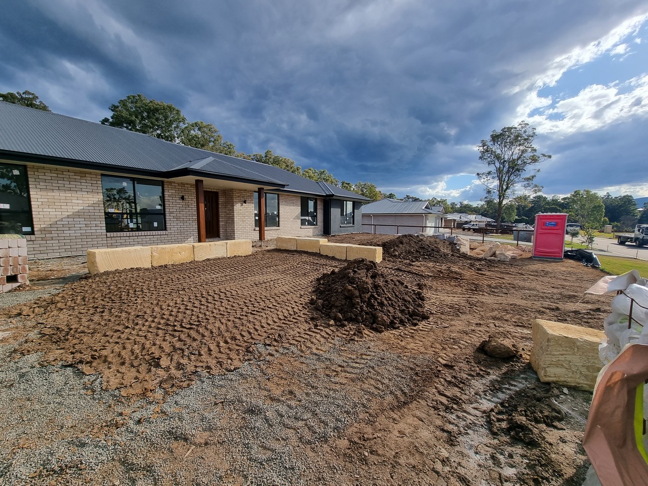 Earthworks and sandstone retaining at new home site