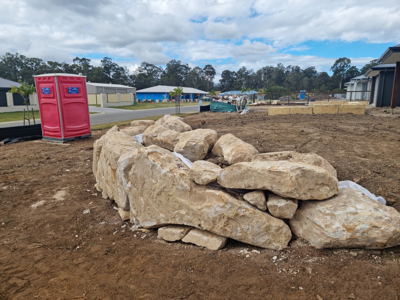 Natural rock retaining wall on residential estate