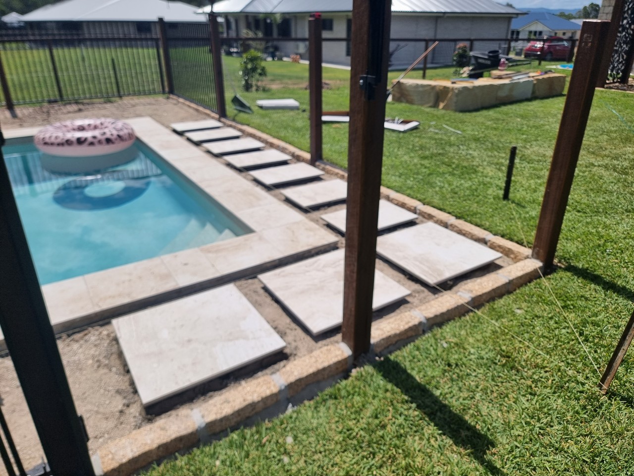 Pool surround paving and stepping stones installation
