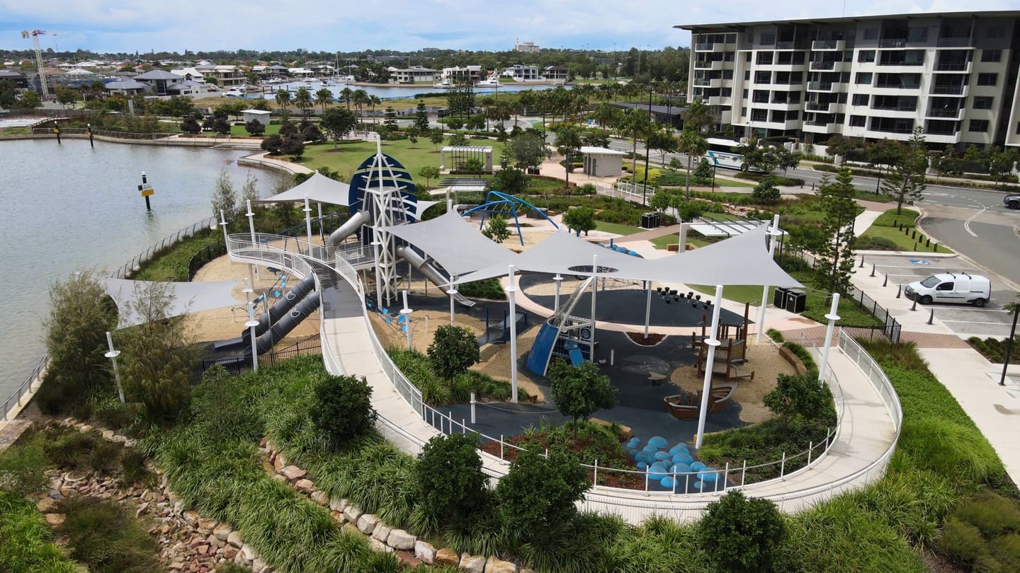 Aerial view of Newport playground with shade sails by the water