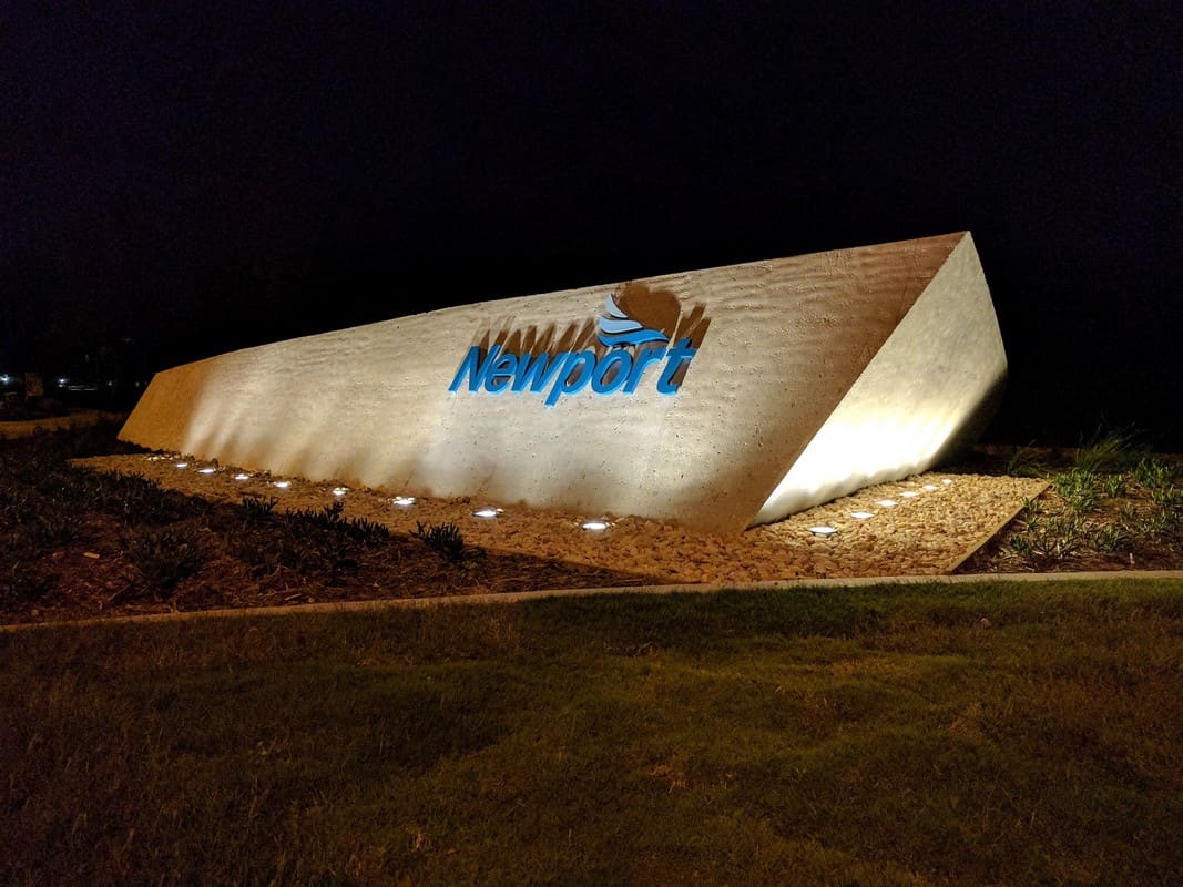 Newport entry feature illuminated at night